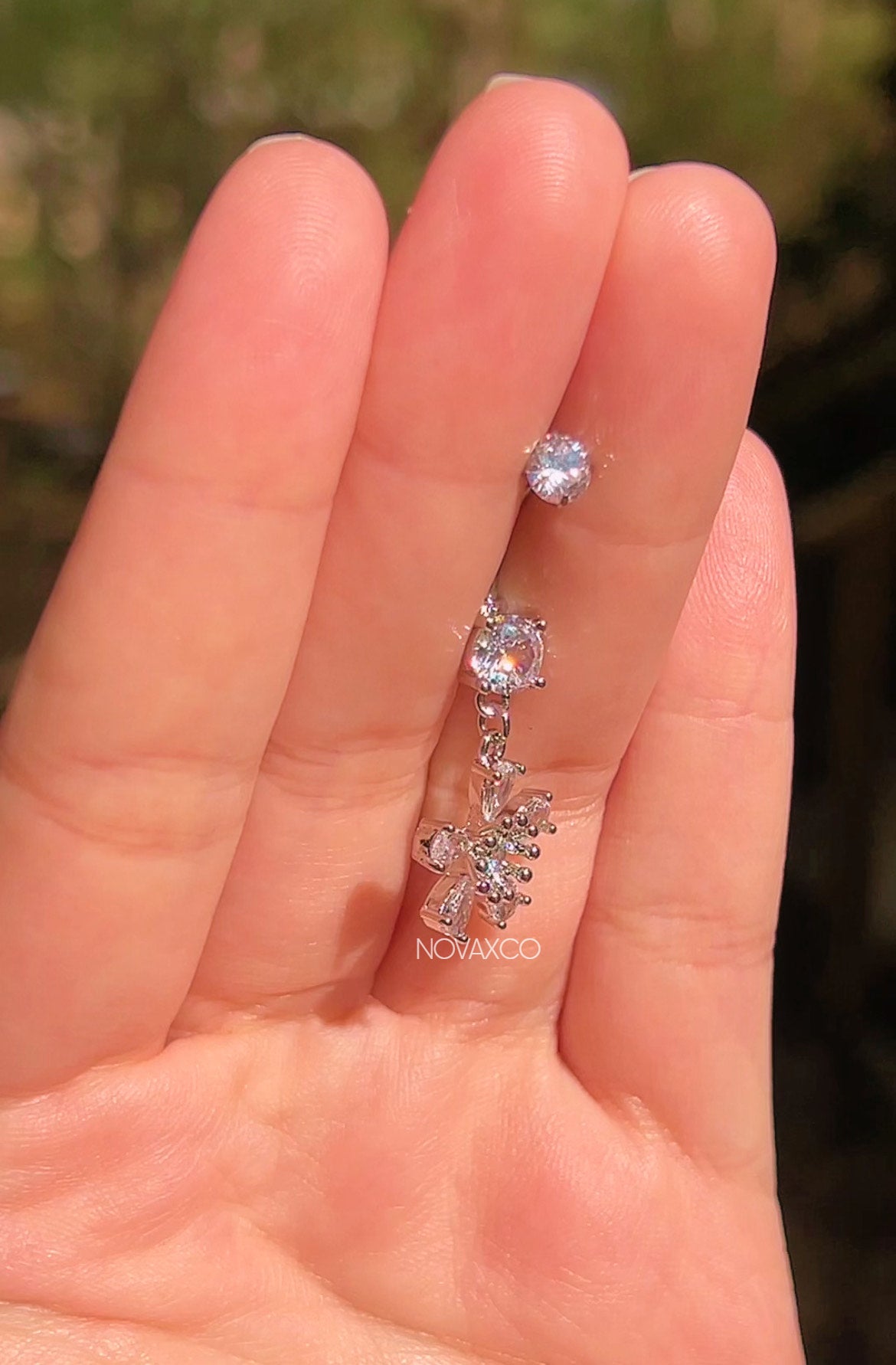 Titanium daisy flower dangle belly ring, another view