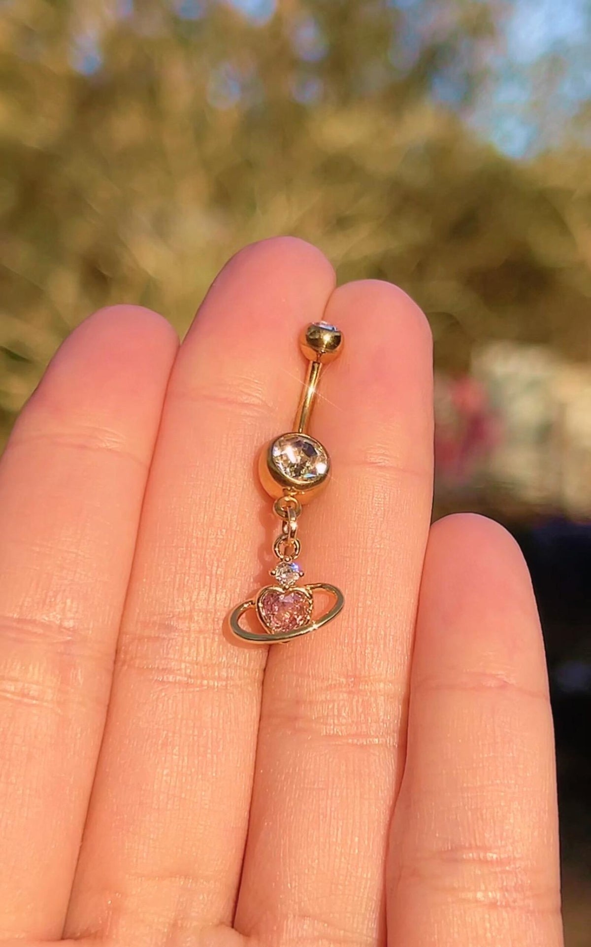 Gold heart planet charm belly ring, another view