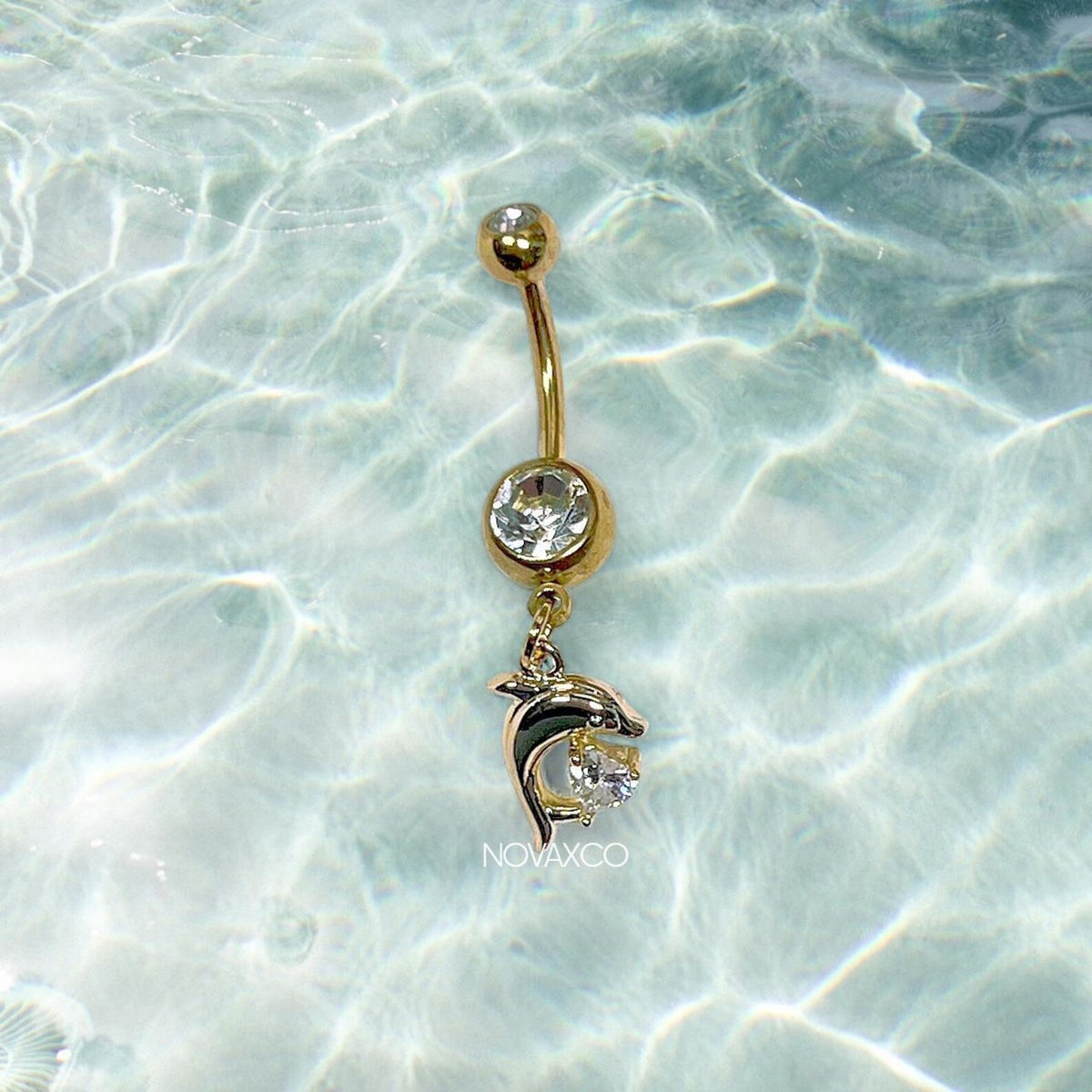 Gold Y2K dolphin belly ring with a heart charm