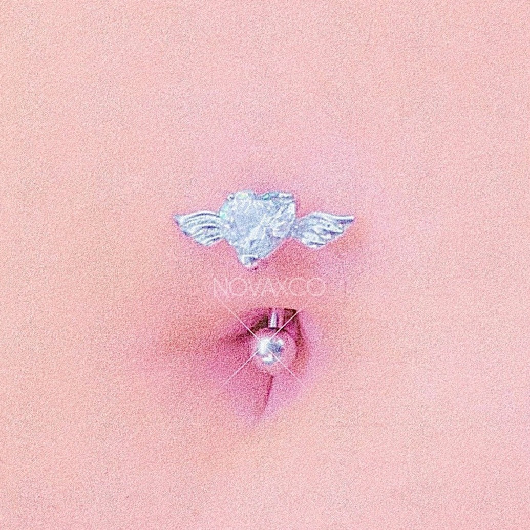 closeup of belly with upside down heart belly ring with clear stone