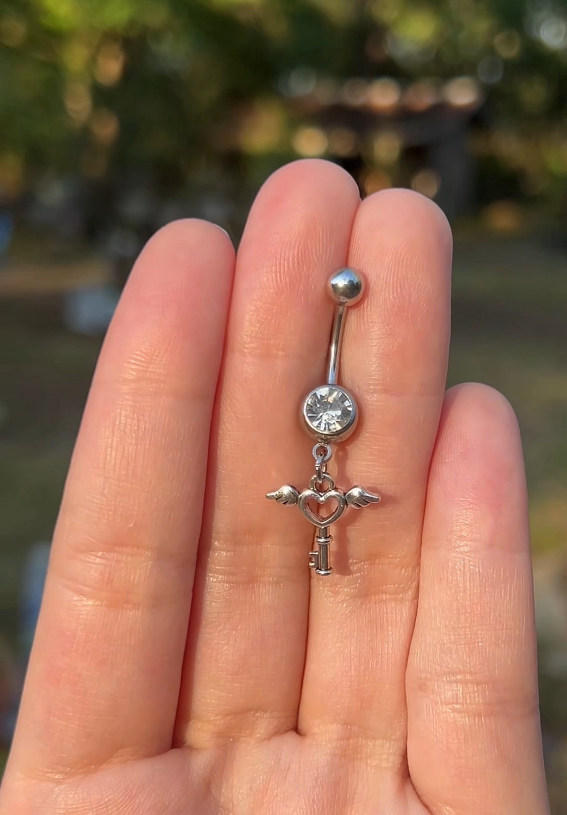Silver belly button ring with angel and heart charm 