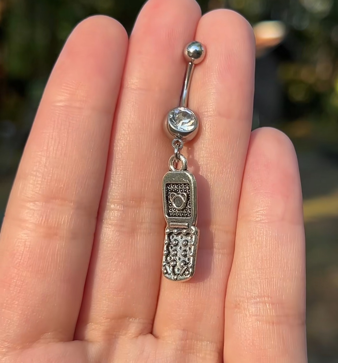 Silver belly button ring with y2k mcbling cell phone charm