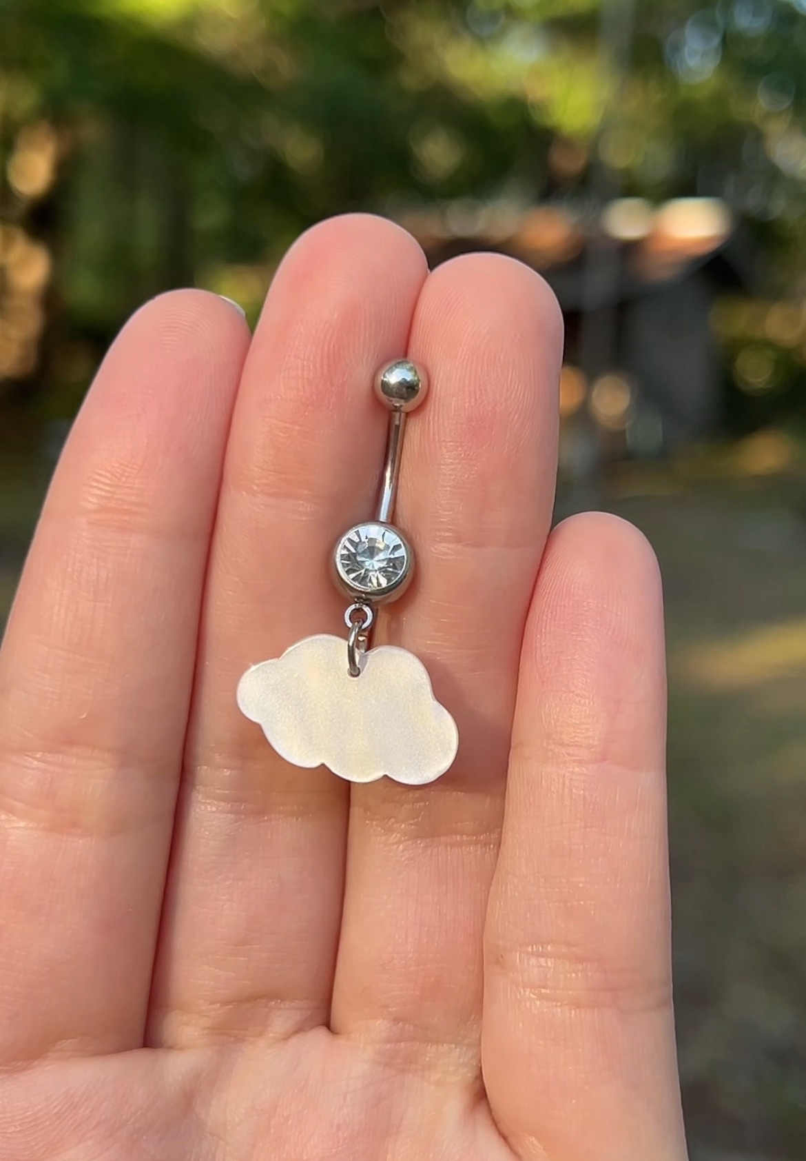 Belly button ring with an ethereal opal cloud charm