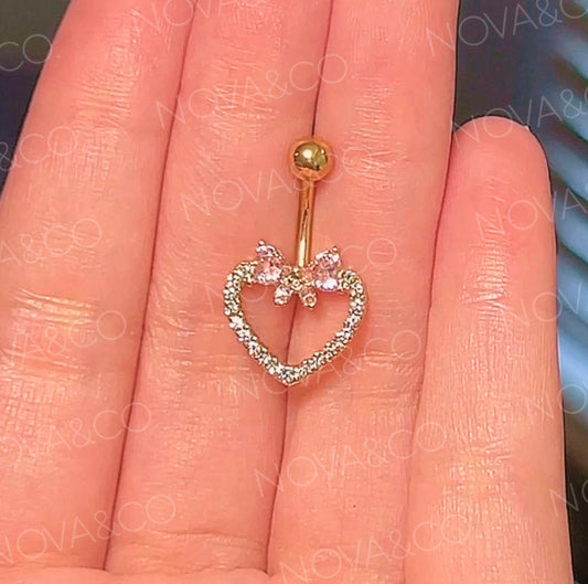 Gold bow and heart belly button ring with pink and clear cubic zirconia. Coquette style.