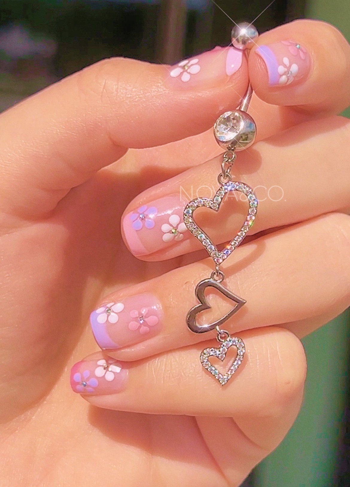 Silver Y2K belly ring with three dangling cubic zirconia hearts