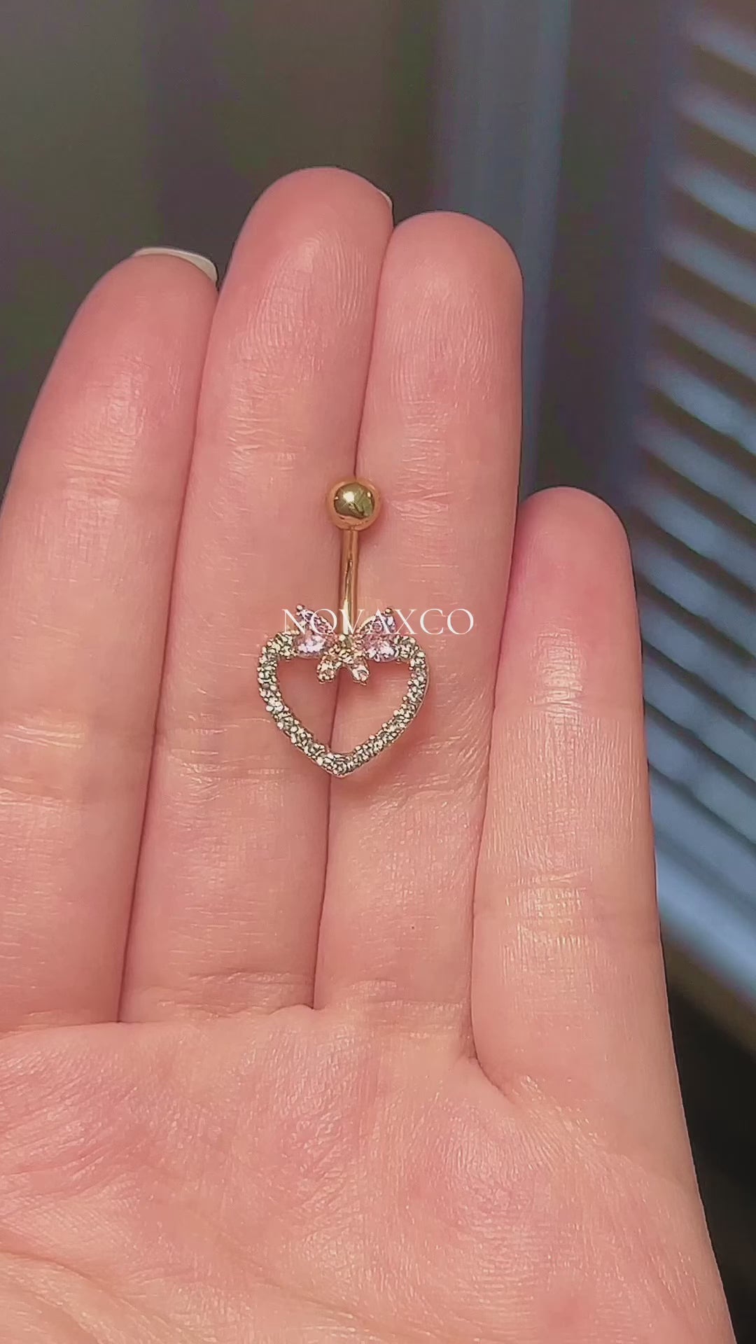 Gold or silver bow and heart belly button ring with pink and clear cubic zirconia. Coquette style.
