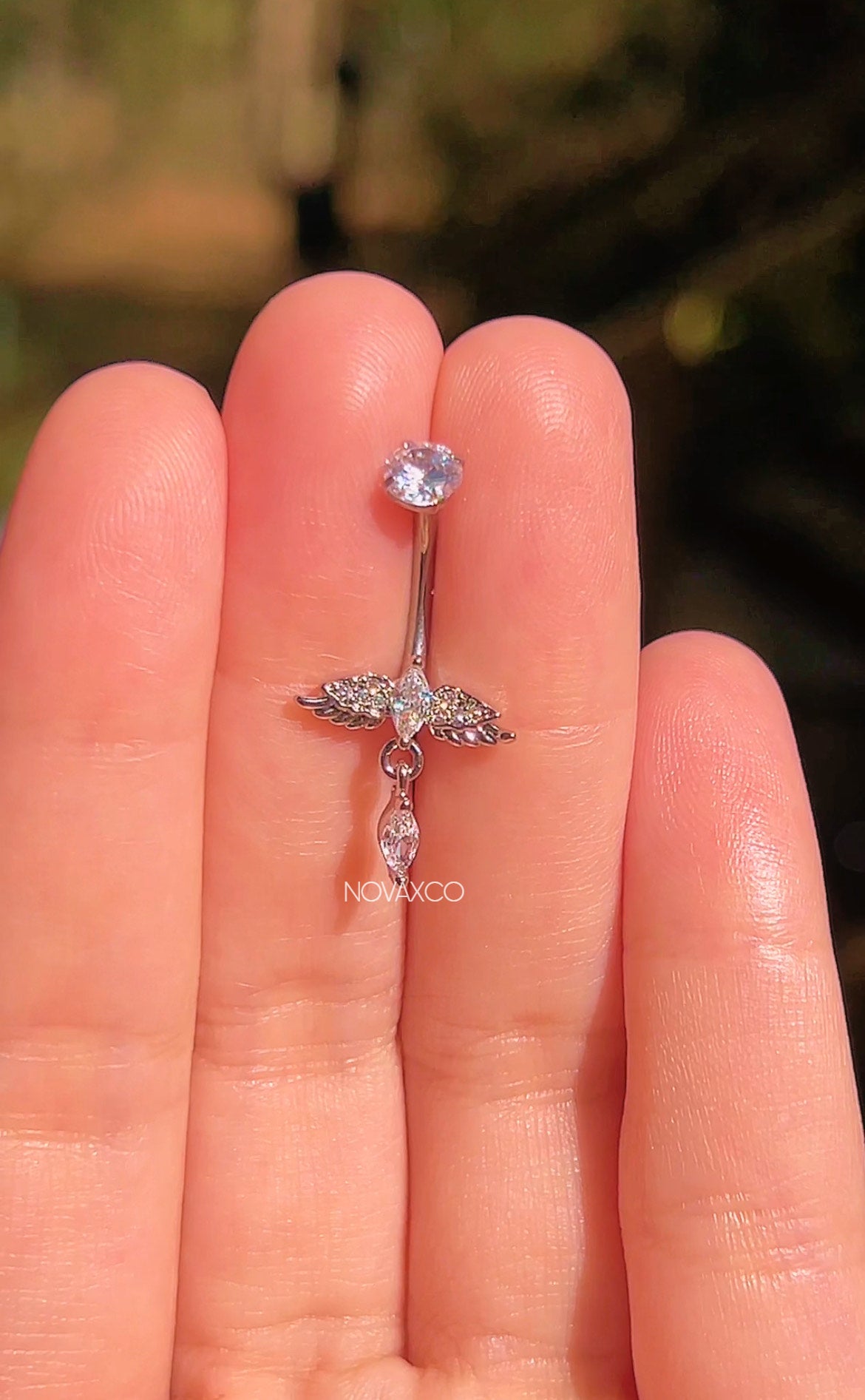 Mini angel wing belly button ring made of implant grade titanium with sparkling marquise cubic zirconia stones