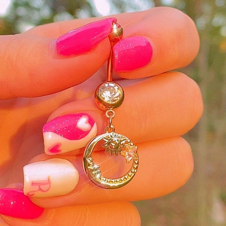 gold belly ring with moon face, sun and star