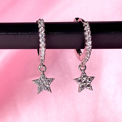 silver hoop earrings with star charm detailing 