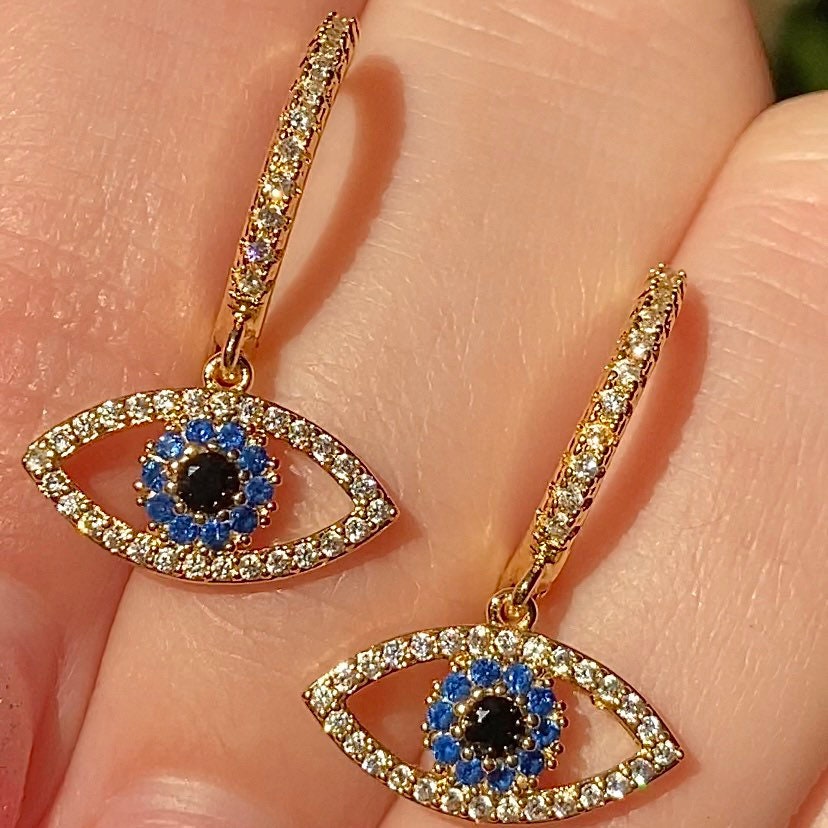 evil eye drop huggie earrings with cubic zirconia encrusted and blue eye in centre