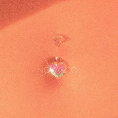 close up of belly with opalescent double heart belly ring